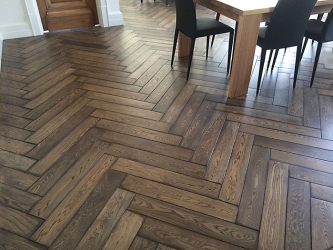 Herringbone size 400x80x19 bevelled and hand stained on site.